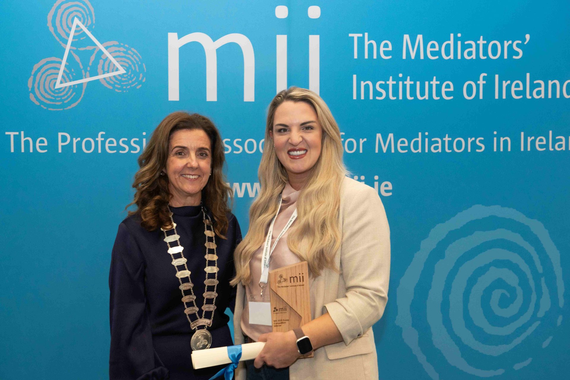 Edel Martin being presented with the award for the MII Essay Competition 2025