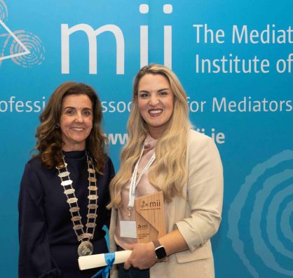 Edel Martin being presented with the award for the MII Essay Competition 2025